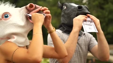 Two Funny People with Horse Head Mask On