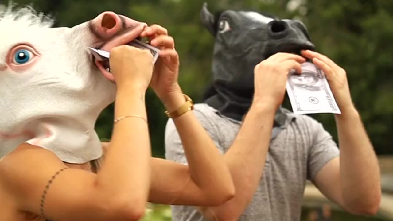 Two Funny People with Horse Head Mask On