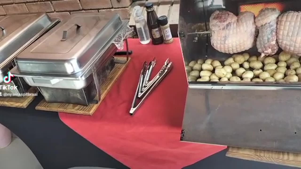 Mini spit braai with legs of lamb