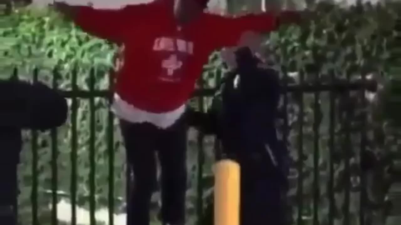 Instant Justice: Suspect gets stuck on a gate