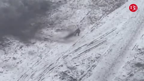 Russian soldier abandons wounded fellow soldier whom he had been dragging on snow and flees