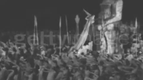 Tiny Hat People Sacrifice Infant (hopefully fake) To Moloch aka Golden Calf
