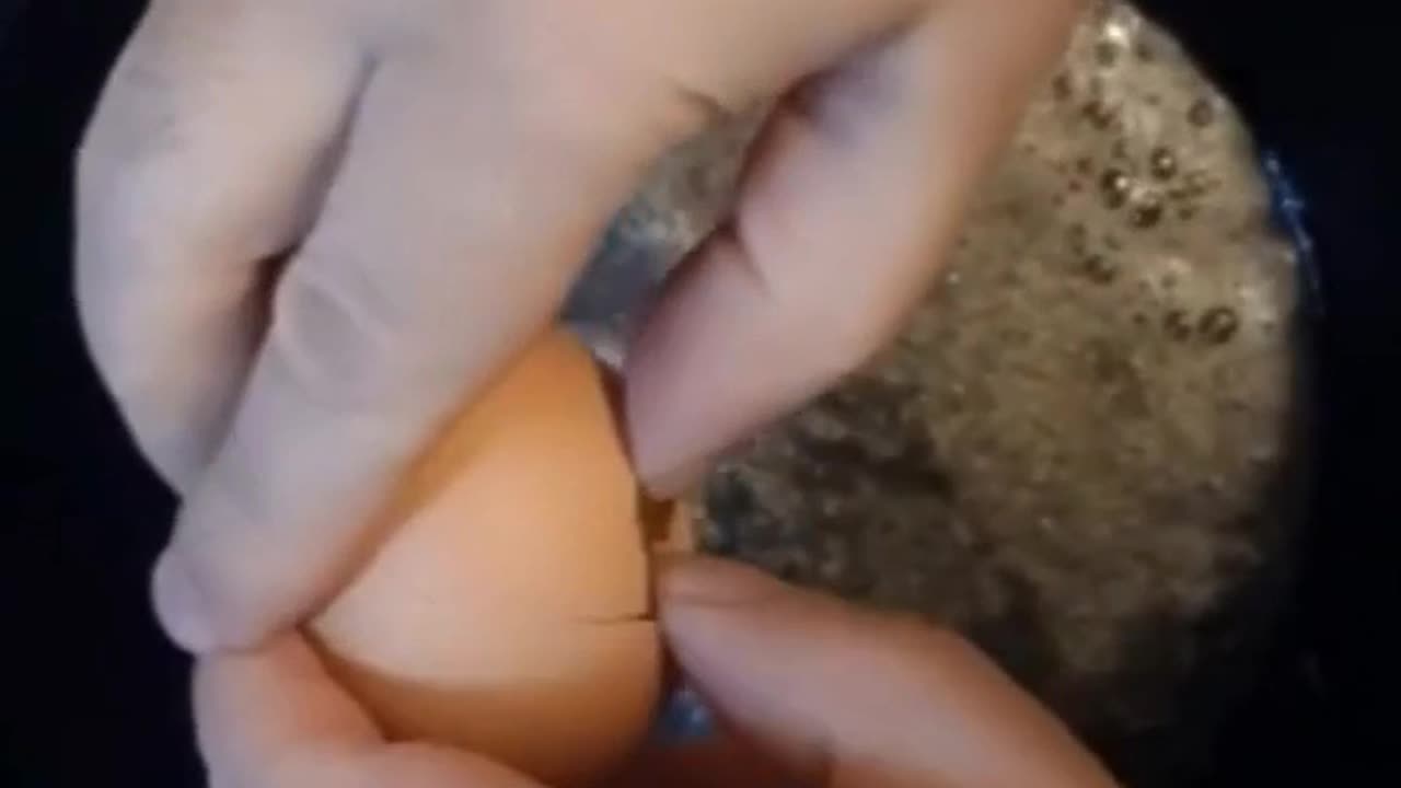 Cracking an egg in reverse lol