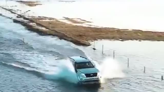 Funny people, crazy driver goes though deep ocen water on his ride home