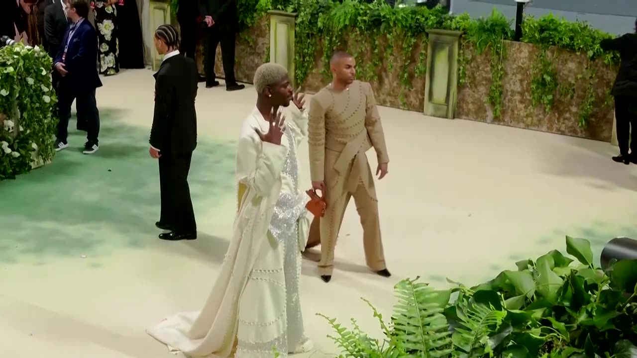 Feathers, flowers and wet shirts at the Met Gala carpet