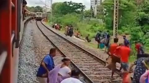 Funny people, group of people almost killed by a train as they cross the tracks