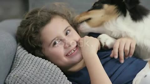 Funny dog enjoying with baby girl