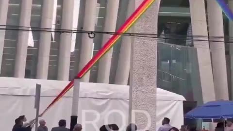 In Mexico, passersby tore down an LGBT flag hanging on a public building