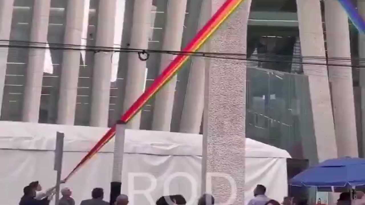 In Mexico, passersby tore down an LGBT flag hanging on a public building