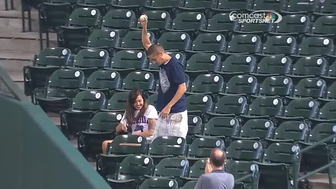 Fan makes catch to save girlfriend from foul ball