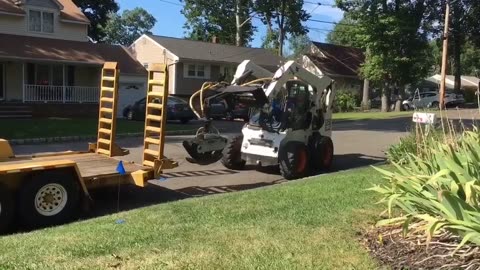 Dropping the ramps and loading a Bobcat with no help. Bobcat Ben