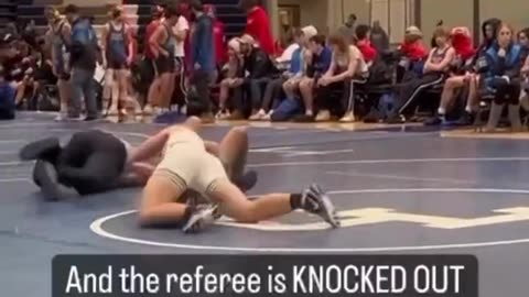 High school wrestling referee KNOCKED OUT by an accidental kick