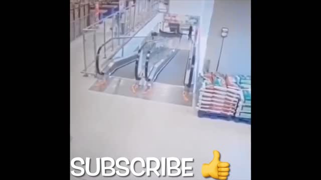 Guy Falls Down Escalator