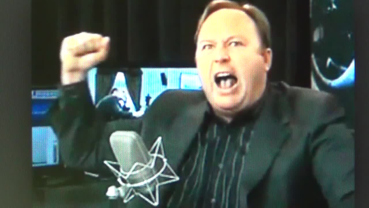 Alex Jones Infowars Hiding Occult Satanic Pentagram & Saturn Rings Symbols by Sean Hross