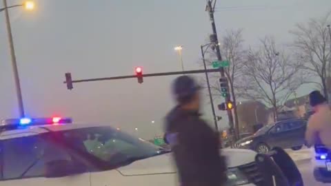 Chicago: Illinois State Trooper caught on video falls off fleeing suspects car hood.