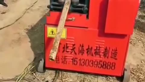 This machine straightens out bent pipes