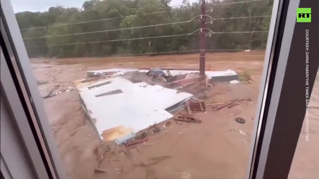 Utility pole RIPS roof in half in Asheville flooding