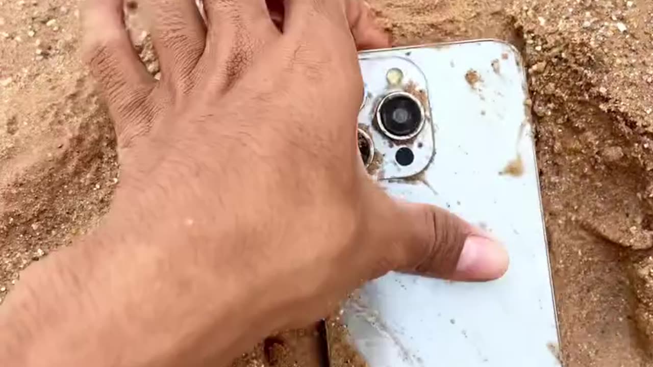 I phone 15 pro max hidden in sand 😱