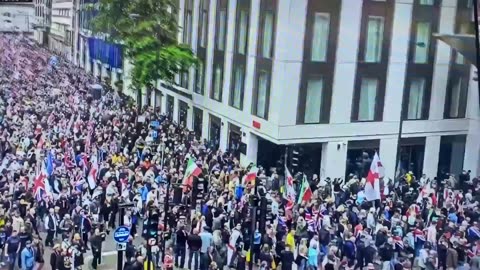 Tens of thousands descend on Parliament to protest the deliberate destruction of their country.