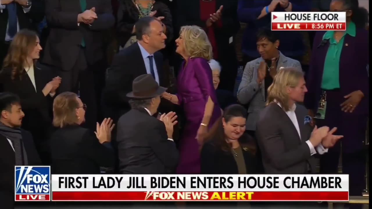 First lady and second gentleman share strange kiss at State of the Union.