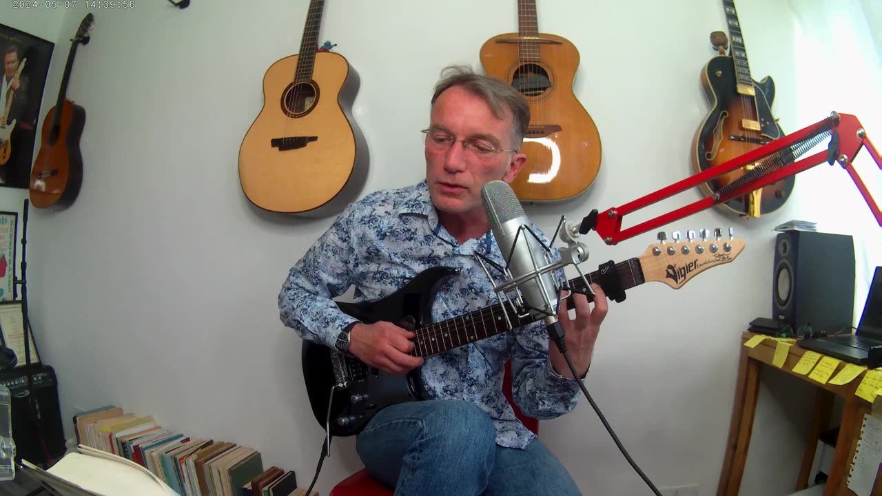 Guitar playing whilst reading a book