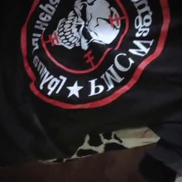 Woman wearing a shirt with a symbol of Private Military Company Wagner