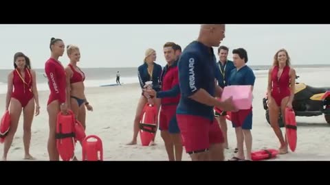 Zachary Vazquez in “Baywatch” Doughnut Scene. Zac Efron / Dwayne Johnson