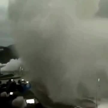 Huge waves hitting the coast of San Sebastian, Spain sends people scattering