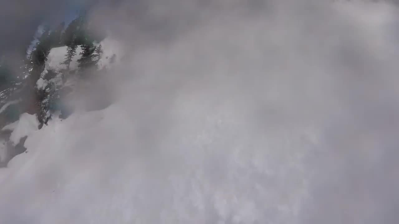 Dude tries to snowmobile up mountain, instantly regrets it