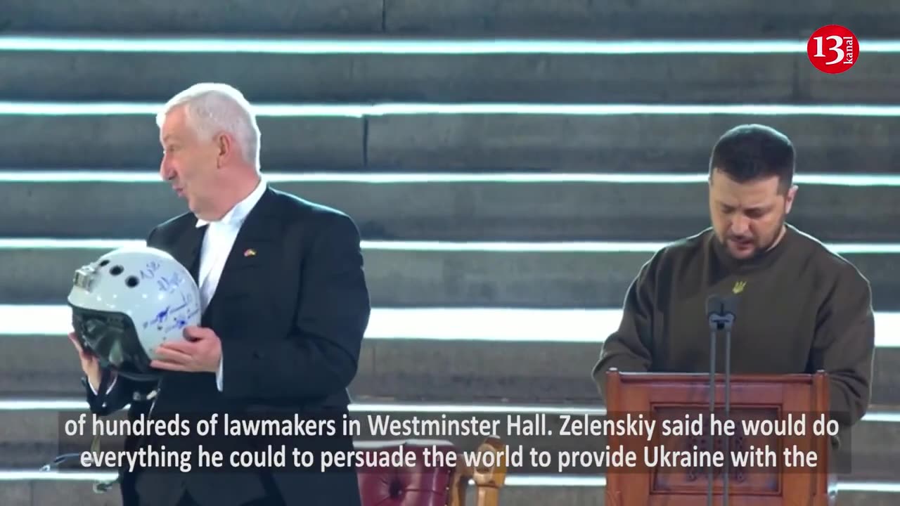 MOMENT: Zelenskiy presents House of Commons speaker with fighter pilot's helmet