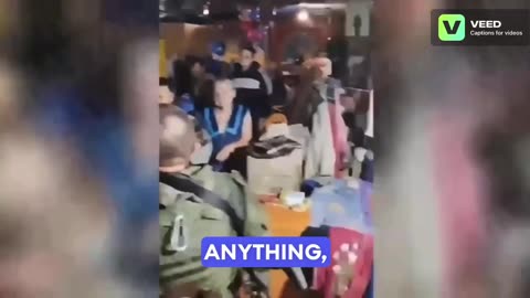 Russian soldier speaking with the civilians of Ugledar who hid in cellars during the fight