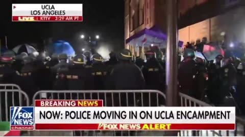 Tear Gas fired at UCLA protesters, as hundreds of riot police storm the encampment.