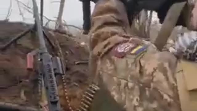 Ukrainians Fire from Trenches