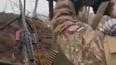 Ukrainians Fire from Trenches