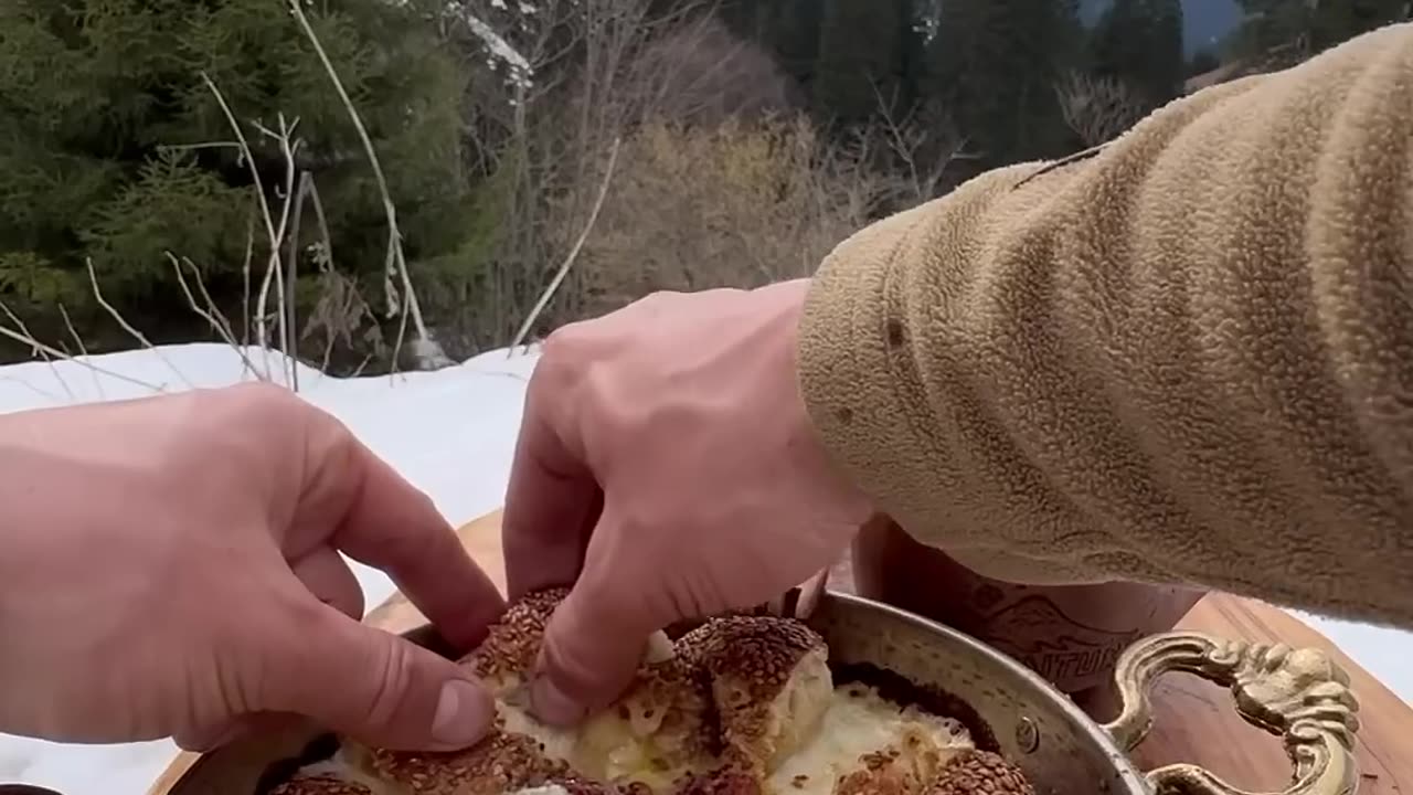 Cooking rice with anchovies on bricks in winter camping