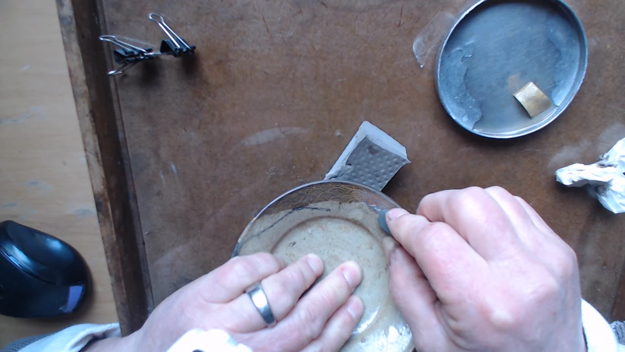 Traditional, lacquer based kintsugi, removing gold