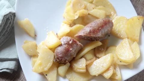 italian sausage & potatoes in pan