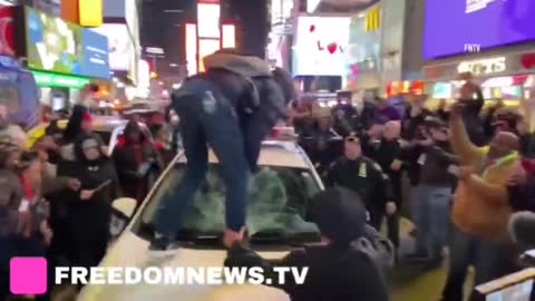 Multiple arrests in New York after a man smashed a police car with his boots