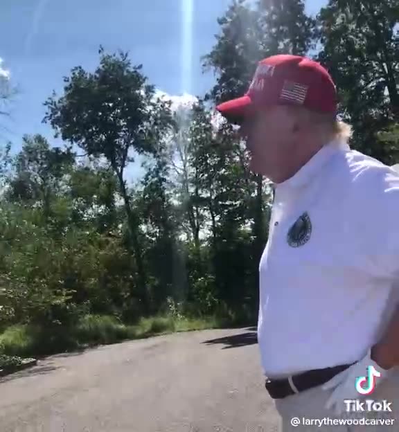 Trump goes to see Larry The Woodcarver