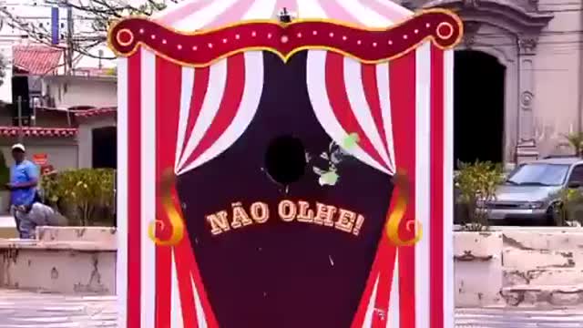 Funny people, guy gets a pie in the face as he looks in the hole, but he looks again & again
