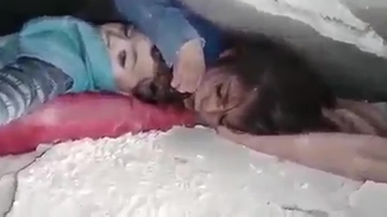 She protected her brother's head under the rubble