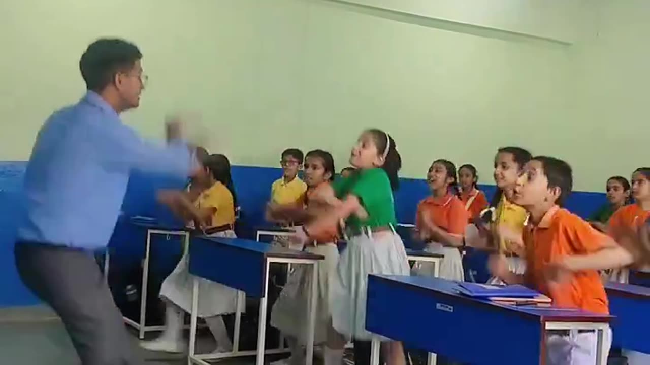 School teacher dancing with the students