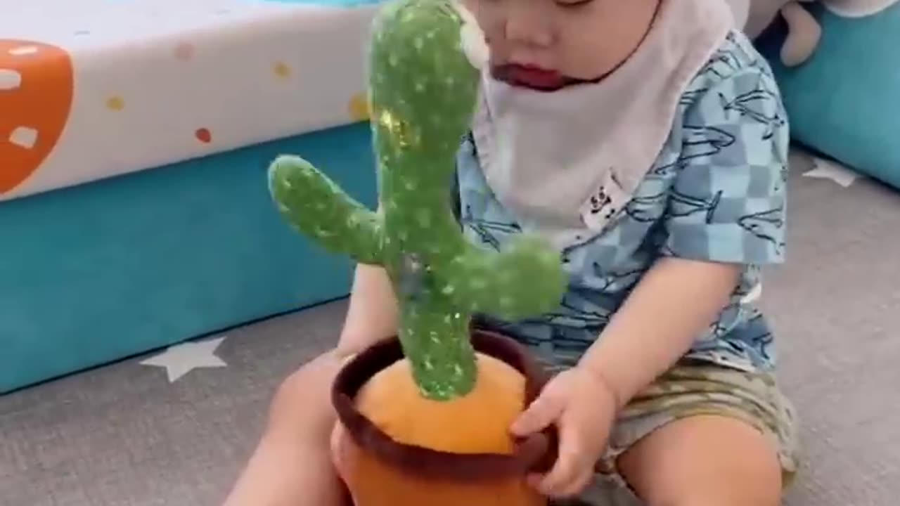 Babies play dancing cactus toy. Cutest baby funniest moments