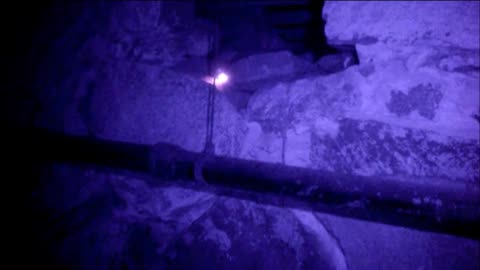 Spirit flashlight session in mansion's basement crawlspace