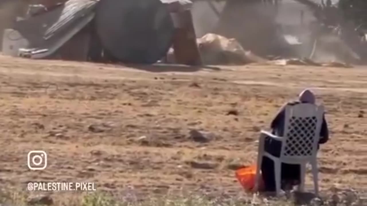 A senior Palestinian lady looks on helplessly as her house in the occupied Naqab is demolished