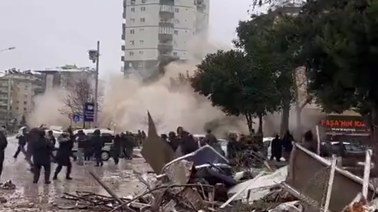 Earthquake aftershock crumbles another building as rescue teams search through rubble in Turkey