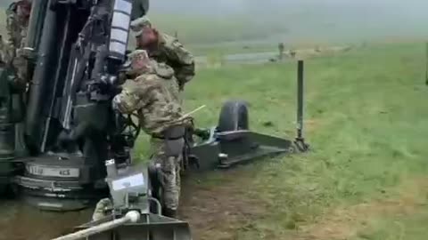 M777 Crew Firing Excalibur Shell
