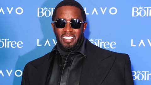 Woman accuses Diddy of threatening to kill her and dangling her over balcony