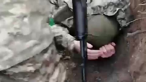 Ukrainian soldier assaulting one of his fellow soldier