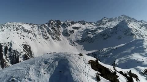 Drone Aerial Flight Over Swiss Mountain Range Golden Hour